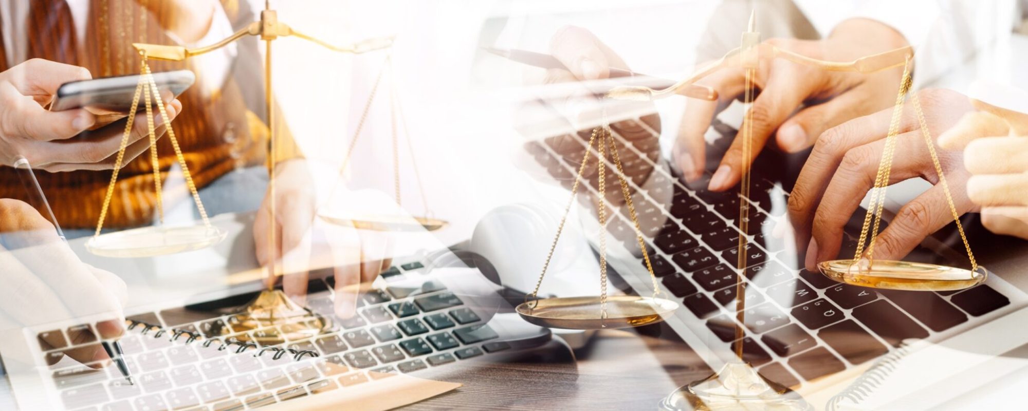 Justice and law concept.Male judge in a courtroom with the gavel, working with, computer and docking keyboard, eyeglasses, on table in morning light exploitation automatisée des écritures
