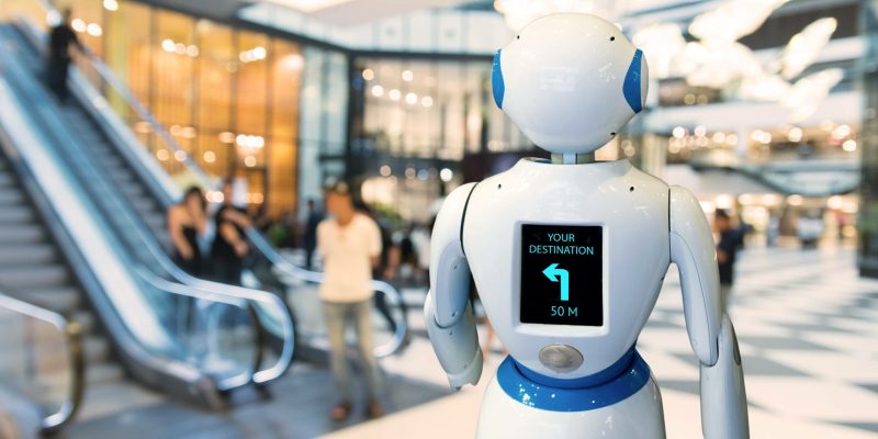 Smart retail , robot assistant , robo advisor navigation robot technology in department store. Robot walk lead to guide customer to destination target. 2025 Droit de la robotique